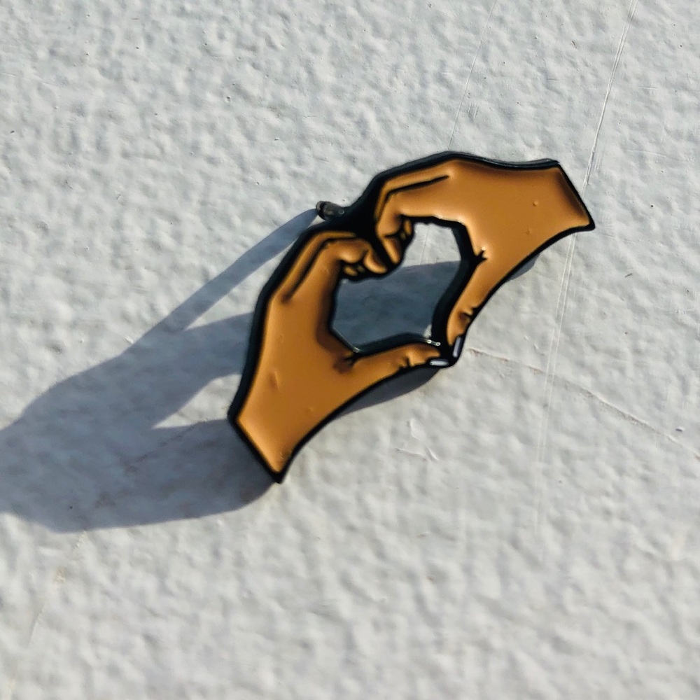 Heart hands enamel pin